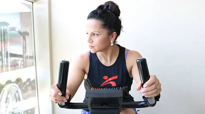 Woman riding a stationary bike